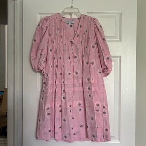 Adorable baby doll hunter bell mini Jenkins dress in light pink with flowers.